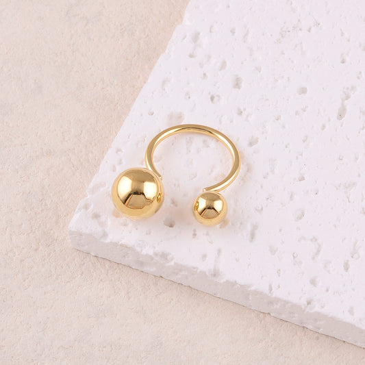 Bague avec deux boules lisses, effet miroir