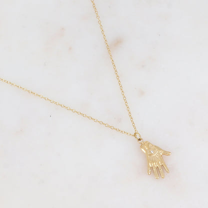 Collier avec pampille forme main orné d'un œil strassé
