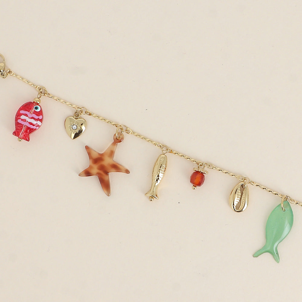 Bracelet - poissons nacré et en résine, cauri, cœur, perle 16+3 cm