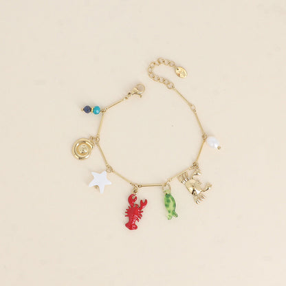 Bracelet - crabe, homard en émail, étoile de mer nacrée, coquillage escargot, poisson en résine, perle d'eau douce et pierres naturelles 17+3 cm