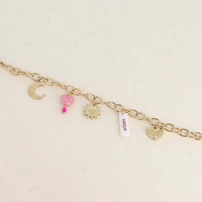 Bracelet - plaquette nacrée avec inscription "AMOUR" en émail, soleil, lune, cœurs (17+3 cm)