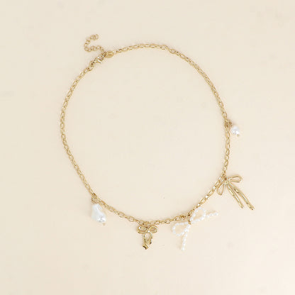 Collier - noeuds papillons avec des pièces en résine blanche 41,5+5 cm