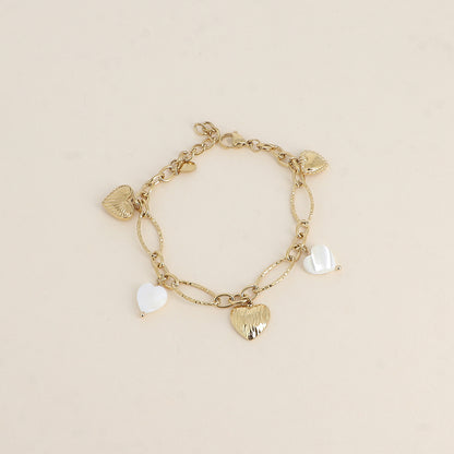 Bracelet - breloques cœurs en nacre blanche (17+3 cm)