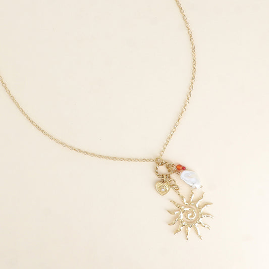 Collier - soleil, perle de résine blanche, cœur et œil 45+7 cm