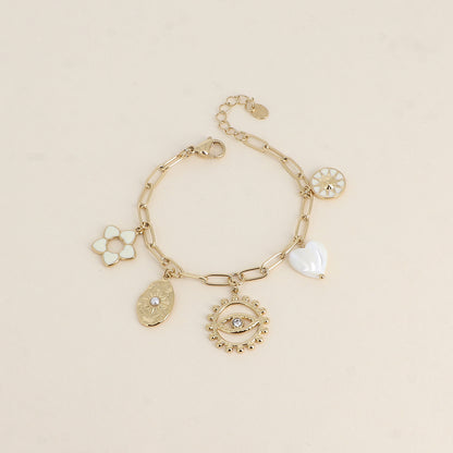 Bracelet - fleur en émail, soleils, cœur nacré, œil (17+3 cm)