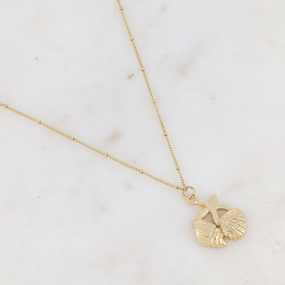 Collier avec pendentif forme étoile de mer et coquillages collés 45+5 cm