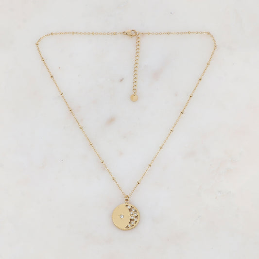Collier doré avec pendentif rond ajouré avec un motif étoile et embelli de strass 40+5 cm