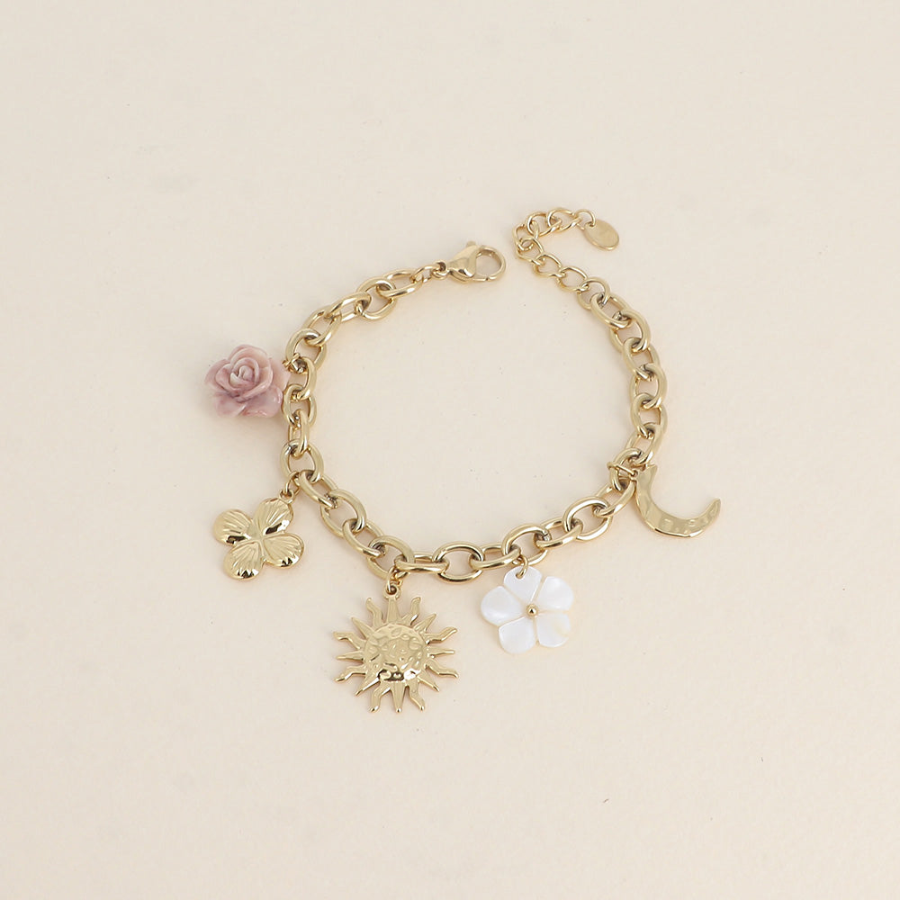 Bracelet - fleur en résine, fleur nacrée, soleil, lune et trèfle (17+3 cm)