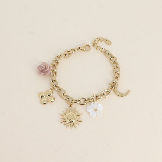 Bracelet - fleur en résine, fleur nacrée, soleil, lune et trèfle (17+3 cm)