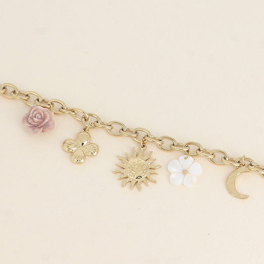 Bracelet - fleur en résine, fleur nacrée, soleil, lune et trèfle (17+3 cm)