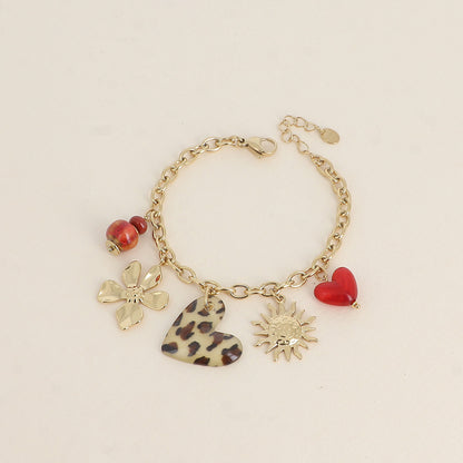Bracelet - perles en céramique, cœurs en résine, soleil et fleur (17+3 cm)