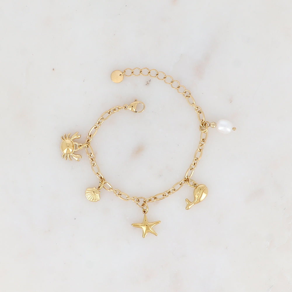 Bracelet en maille avec crabe, coquillages, étoile de mer, baleine et perle d'eau douce