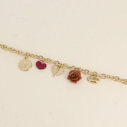Bracelet - breloques diverses (soleil, cœur en résine, cœur incurvé, rose en résine, bouche) (17+3 cm)