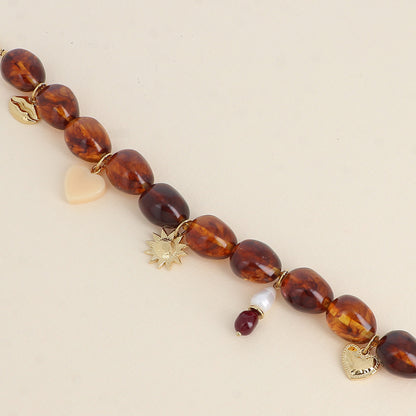 Bracelet sur fil - perles en résine et pampilles en acier inoxydable (cœur, perles de résine, soleil, cœur en résine et bouche) (19+3 cm)