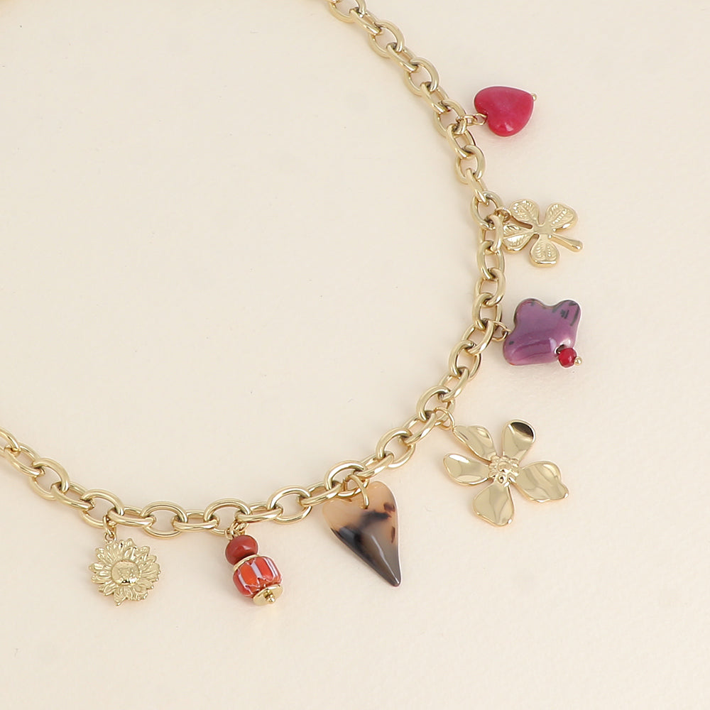 Collier - perles et oiseau en céramique, trèfle, cœur en résine léopard et fleur 40+5 cm