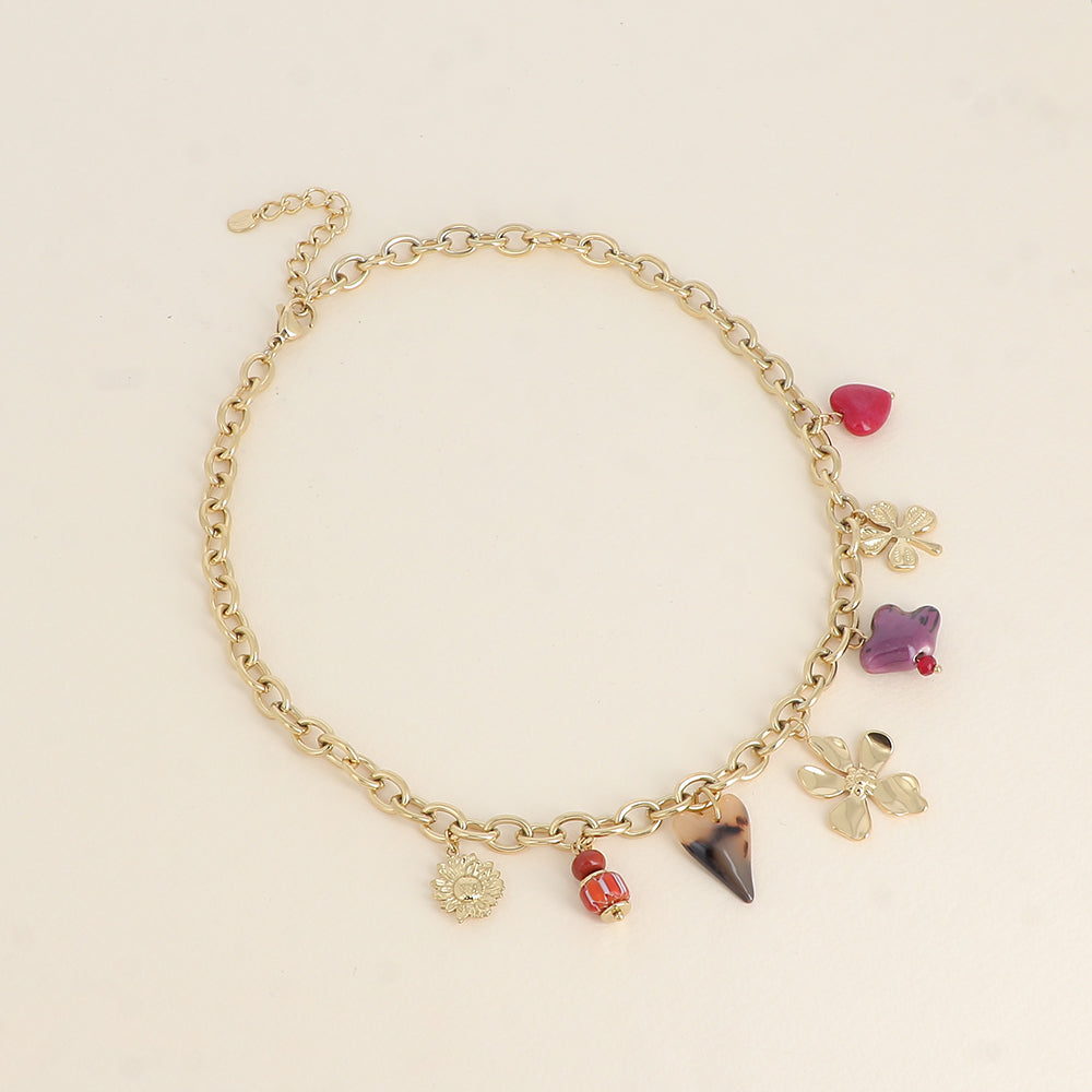 Collier - perles et oiseau en céramique, trèfle, cœur en résine léopard et fleur 40+5 cm