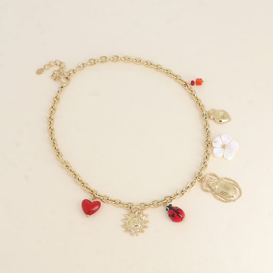 Collier - soleil, coccinelle en céramique émaillée, scarabée, fleur nacrée, cœurs 40+5 cm