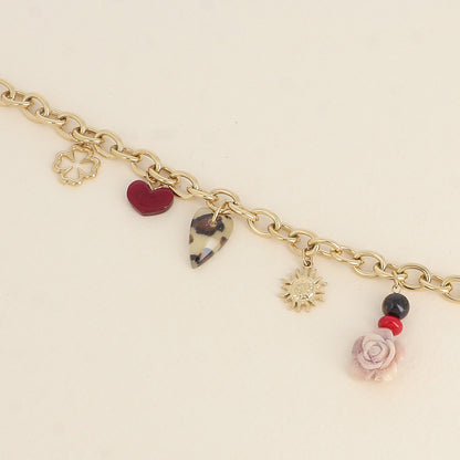 Bracelet - pendentifs (trèfle ajouré, cœurs en résine, rose, soleil et perles) (17+3 cm)