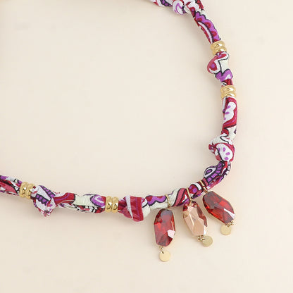 Collier sur tissu - orné de 3 cristaux de Swarovski® - Rose gold