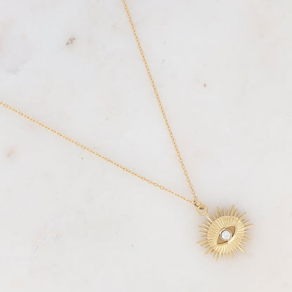 Collier doré avec pampille graphique ajourée avec œil strassé 38+7 cm