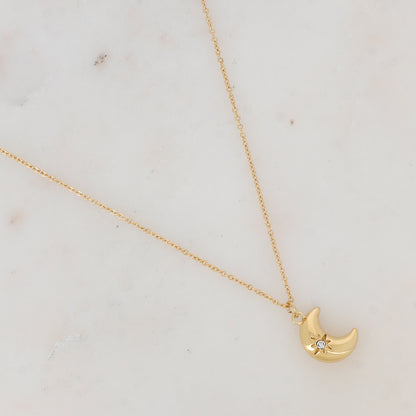 Collier doré avec pampille forme lune ornée d'une étoile strassé 38+7 cm