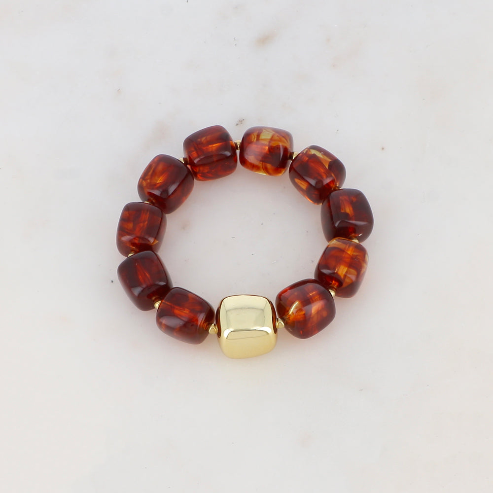 Bracelet élastique avec perles en résine colorée et perle métallique