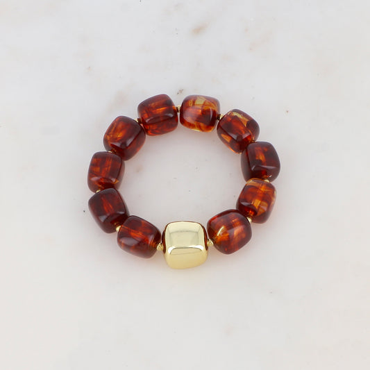 Bracelet élastique avec perles en résine colorée et perle métallique