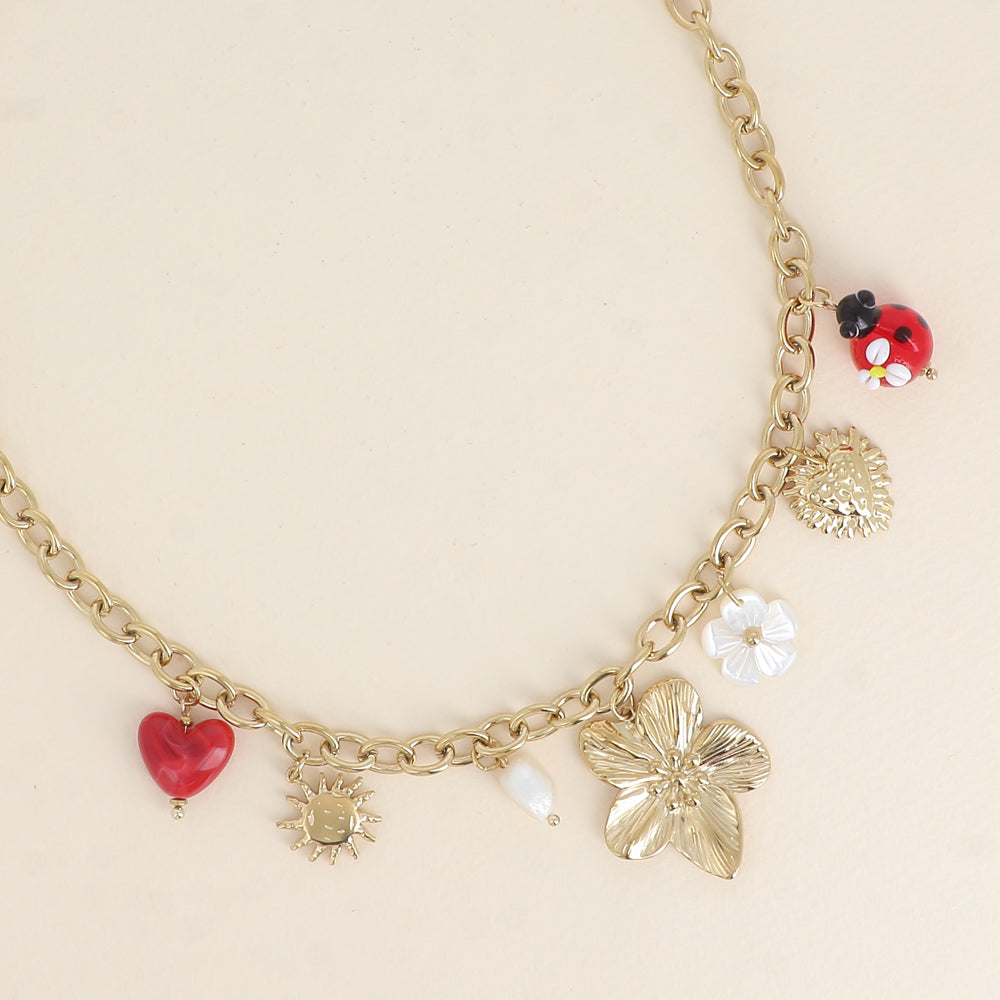 Collier - pendentifs (fleur, coccinelle en résine, fleur nacrée, cœur, soleil) 40+7 cm
