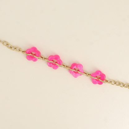 Bracelet - 4 fleurs en résine fuchsia et maillons ovales (17+3 cm / dimension approximative d'une fleur: 20 x 20 mm)