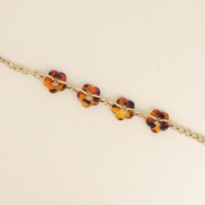 Bracelet - 4 fleurs en résine léopard et maillons ovales (17+3 cm / dimension approximative d'une fleur: 20 x 20 mm)