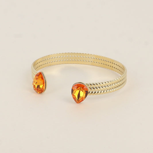 Jonc - anneau tressé orné de 2 cristaux de Swarovski® en forme de goutte - Dark orange - Dimensions intérieures : 58 x 48 mm Epaisseur du jonc : 8 mm