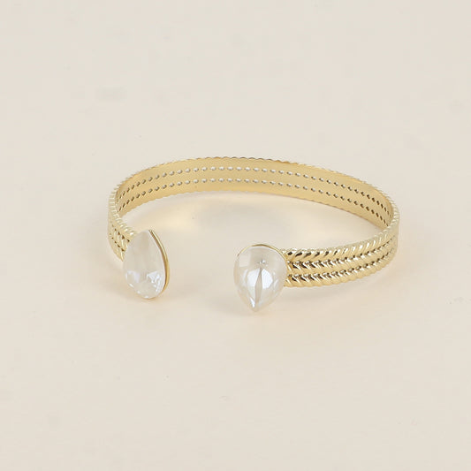 Jonc - anneau tressé orné de 2 cristaux de Swarovski® en forme de goutte - Linen ignite - Dimensions intérieures : 58 x 48 mm Epaisseur du jonc : 8 mm