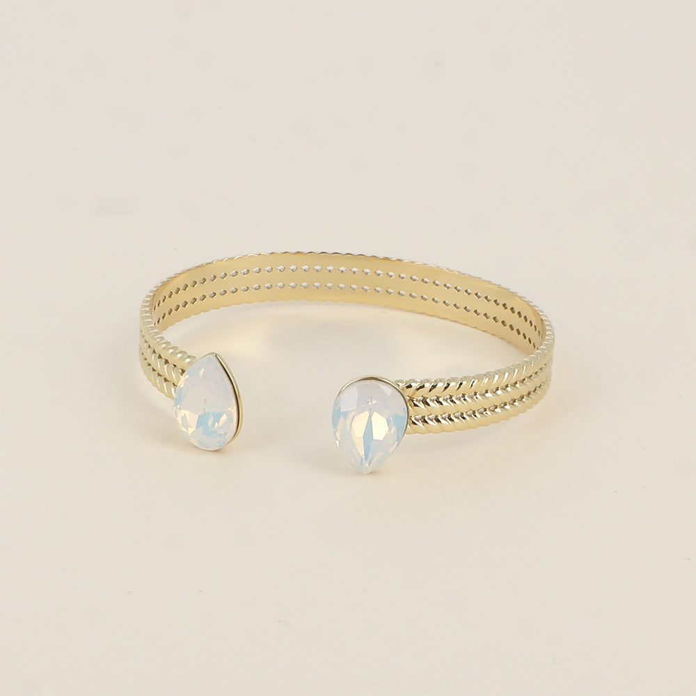 Jonc - anneau tressé orné de 2 cristaux de Swarovski® en forme de goutte - White opal - Dimensions intérieures : 58 x 48 mm Epaisseur du jonc : 8 mm