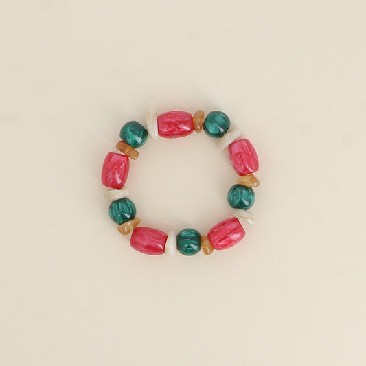 Bracelet élastique - perles en résine fushia