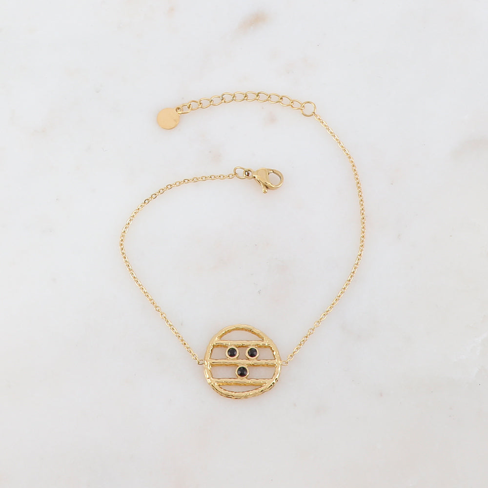 Bracelet avec une pièce ronde et 3 strass