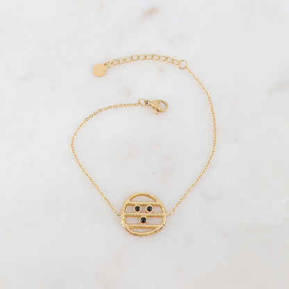 Bracelet avec une pièce ronde et 3 strass