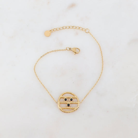 Bracelet avec une pièce ronde et 3 strass