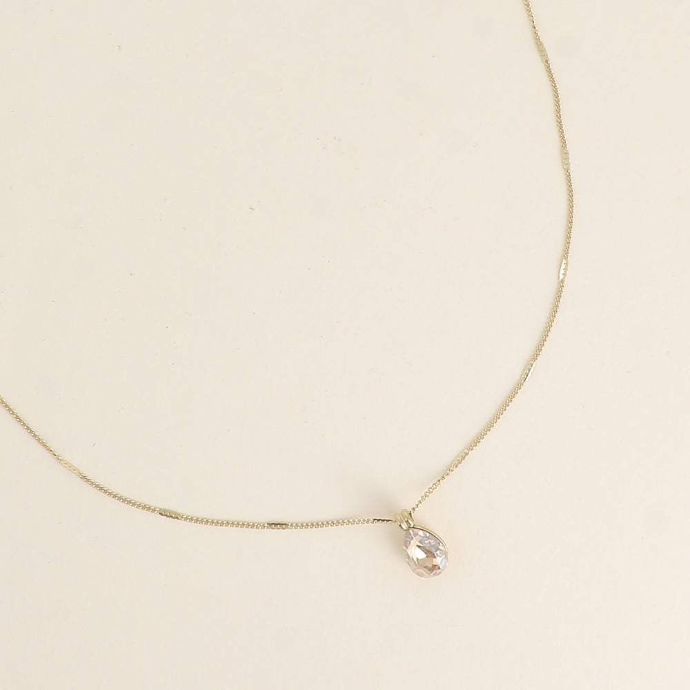 Collier orné de cristaux de Swarovski® en forme de goutte - Longueur de chaîne : 38+7 cm - Dimensions du cristal : 7x10 mm - Golden shadow