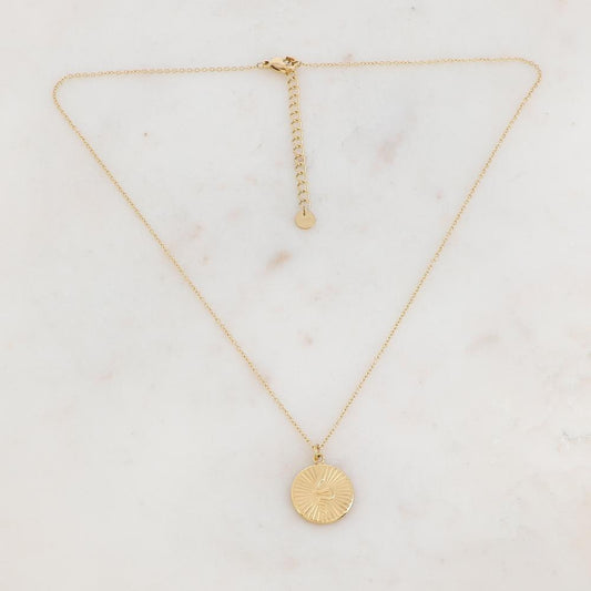 Collier doré avec un pendentif rond effet soleil et serpent 41+5 cm