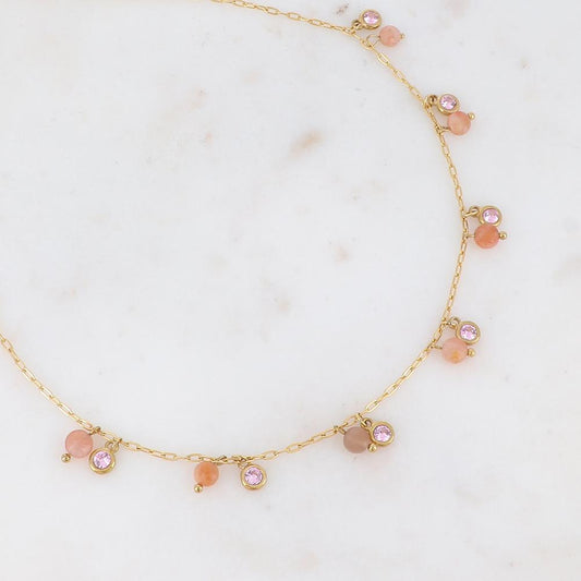 Collier doré embelli de pierres et de strass roses 38+5 cm