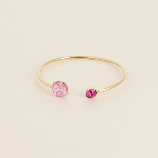Jonc orné de cristaux de Swarovski® 10 mm et SS29 - Hauteur du jonc: 11 mm - Dimension du cristal 1: 10x10 mm - Diamètre du cristal 2: 7 mm - Light rose foncé et fuschia