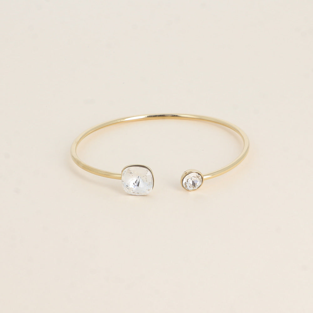 Jonc orné de cristaux de Swarovski® 10 mm et SS29 - Hauteur du jonc: 11 mm - Dimension du cristal 1: 10x10 mm - Diamètre du cristal 2: 7 mm - Crystal mat et brillant