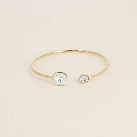 Jonc orné de cristaux de Swarovski® 10 mm et SS29 - Hauteur du jonc: 11 mm - Dimension du cristal 1: 10x10 mm - Diamètre du cristal 2: 7 mm - Crystal mat et brillant