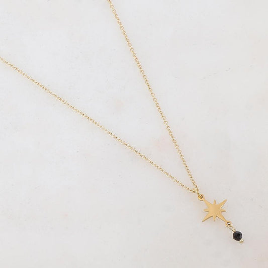 Collier doré composé d'une étoile et d'une pierre noire 39+5 cm