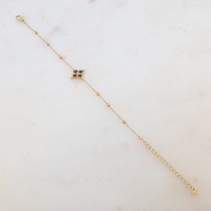 Bracelet avec pièce ornée de 4 strass, petites boules