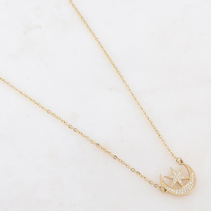 Collier doré composé d'un pendentif étoile et lune ornée de strass blancs 40+5 cm