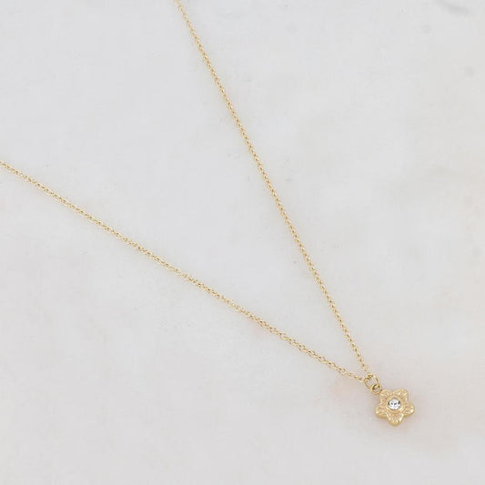 Collier doré avec un pendentif fleur serti d'un strass blanc 41+5 cm