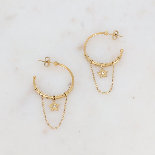 Créoles à puce avec chaînes tombantes, petites rondelles et pampille étoile strassée 2,8 x 6 cm.